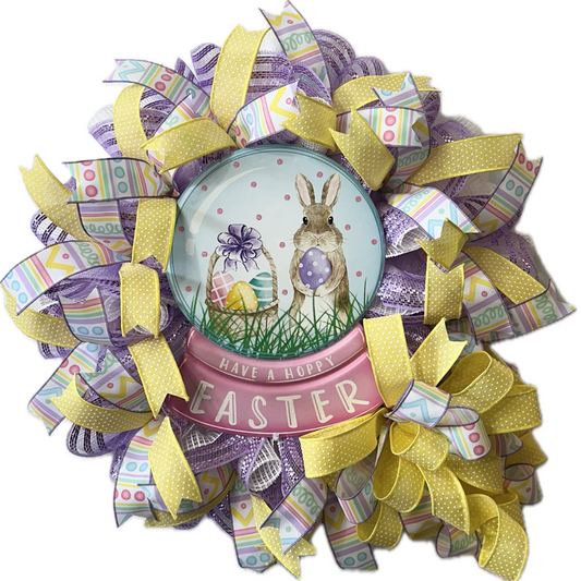 Decorative Easter wreath with colorful ribbons and a bunny design wreath sign 