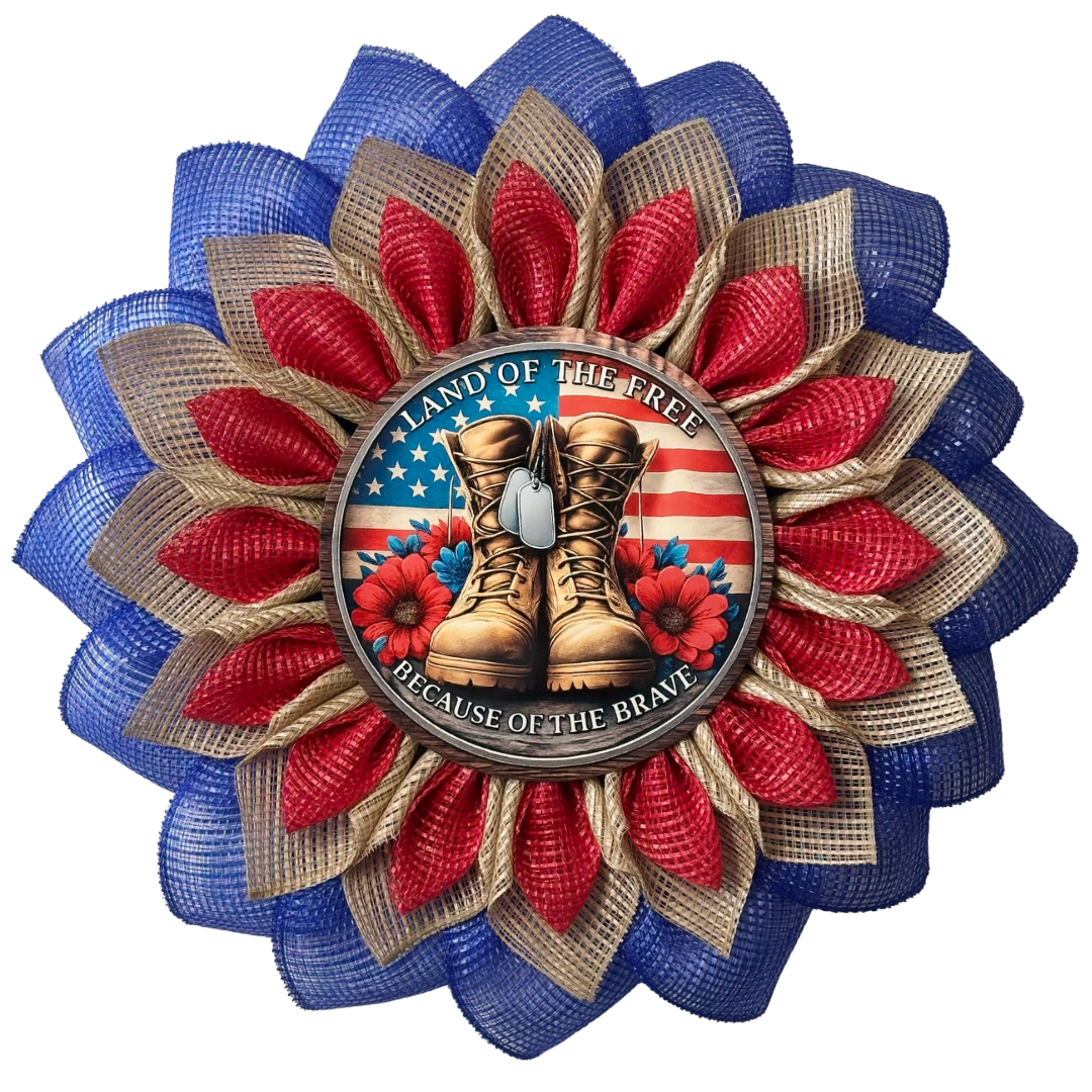 Red blue and natural flower wreath with a flag and veteran themed metal sign center with text "land of the free because of the brave" designed by Monkey's Creations