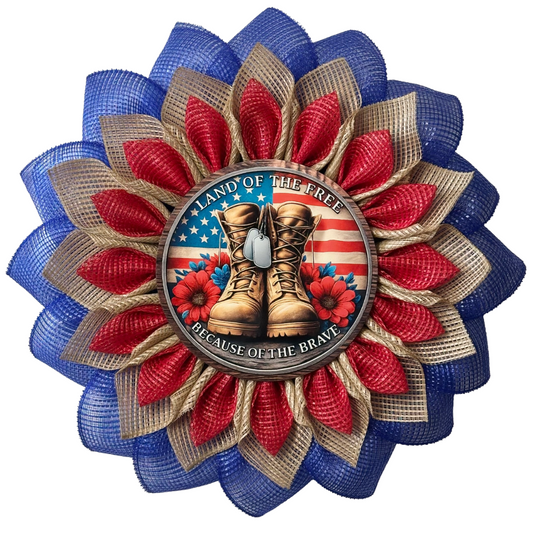 Red blue and natural flower wreath with a flag and veteran themed metal sign center with text "land of the free because of the brave" designed by Monkey's Creations