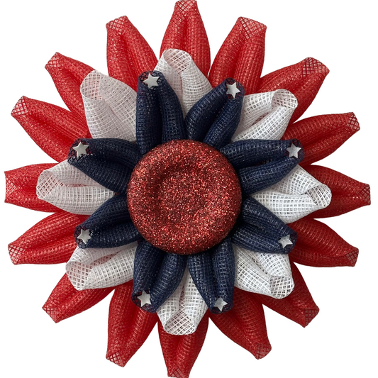 Deco mesh flower wreath with red, white, and blue colors, white stars and a red glitter center by Monkey's Creations