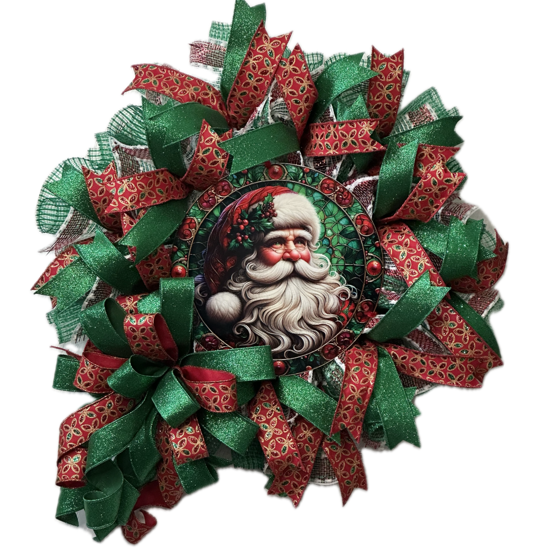 A red green and gold deco mesh and ribbon Christmas wreath with a vintage Santa Claus metal wreath sign center by Monkey's Creations.