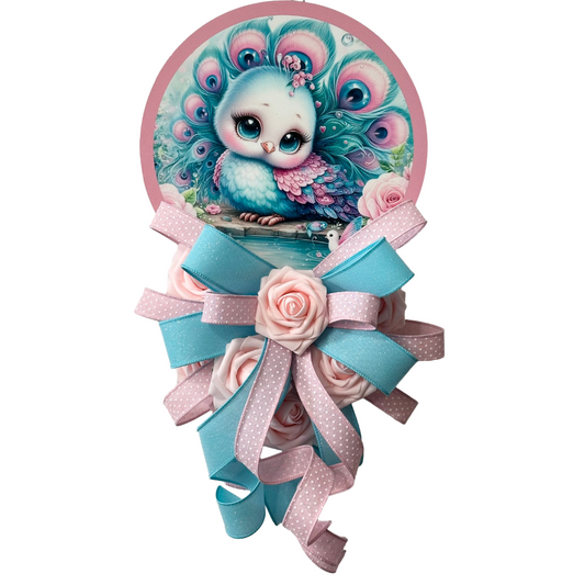 Pastel peacock door hanger with a pink and teal ribbon bow by Monkey's Creations