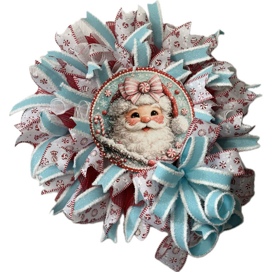 Deco mesh and ribbon wreath by Monkey's Creations featuring a peppermint candy themed light blue, red and white Santa Claus for Christmas