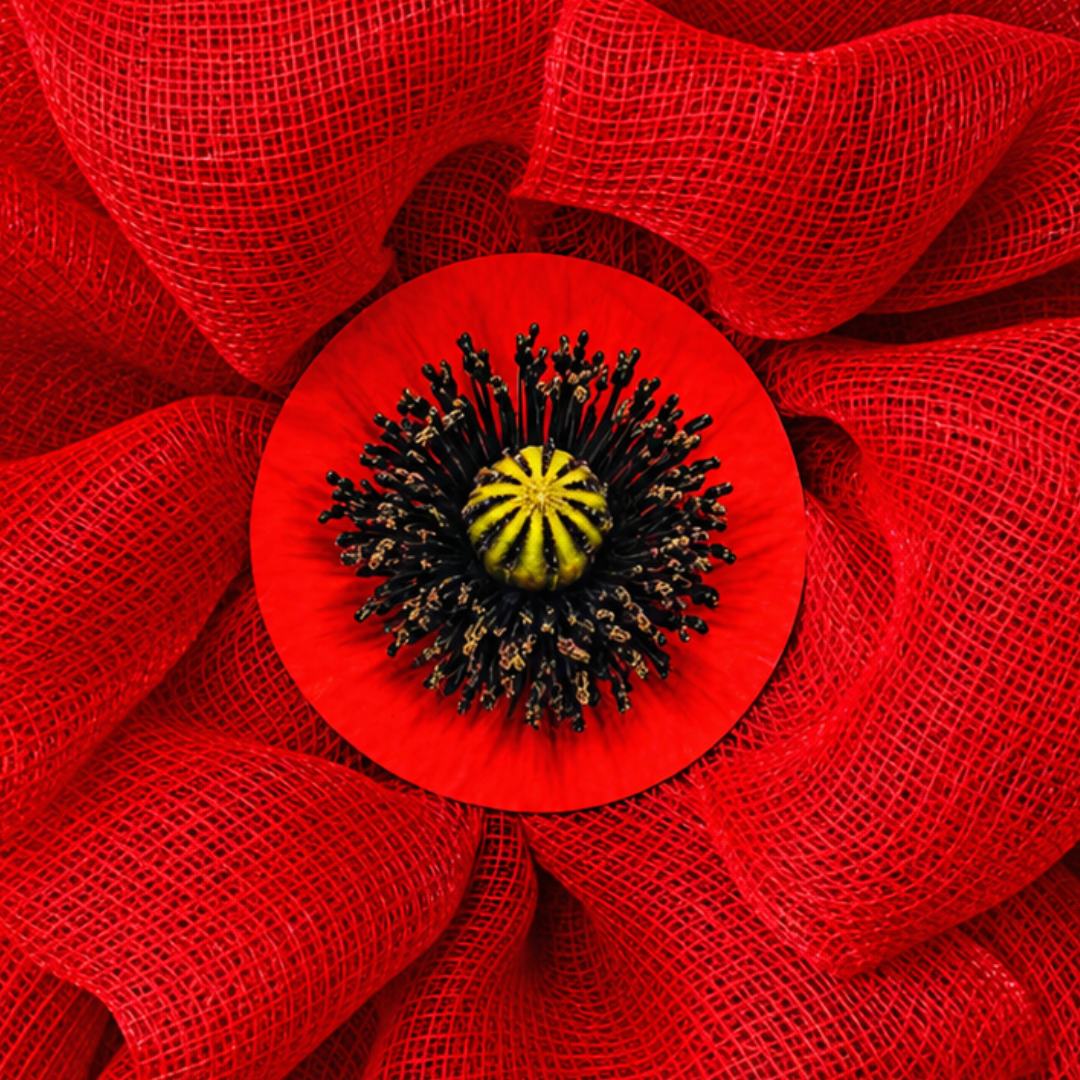 Red deco mesh poppy flower with a realistic flower center for Veteran's Day and Remembrance Day by Monkey's Creations. 