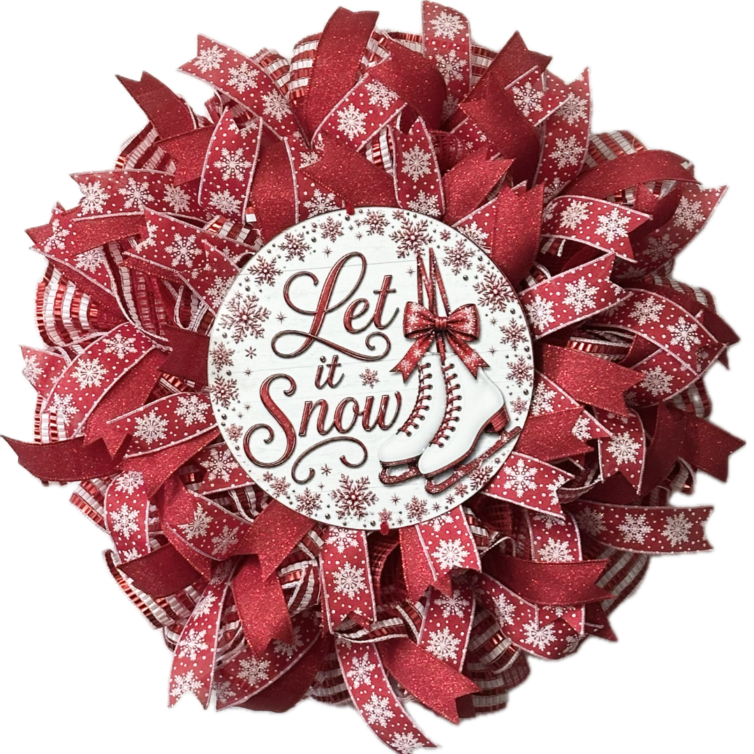 Red and white deco mesh and ribbon wreath featuring ice skates and "let it snow" by Monkey's Creations. 