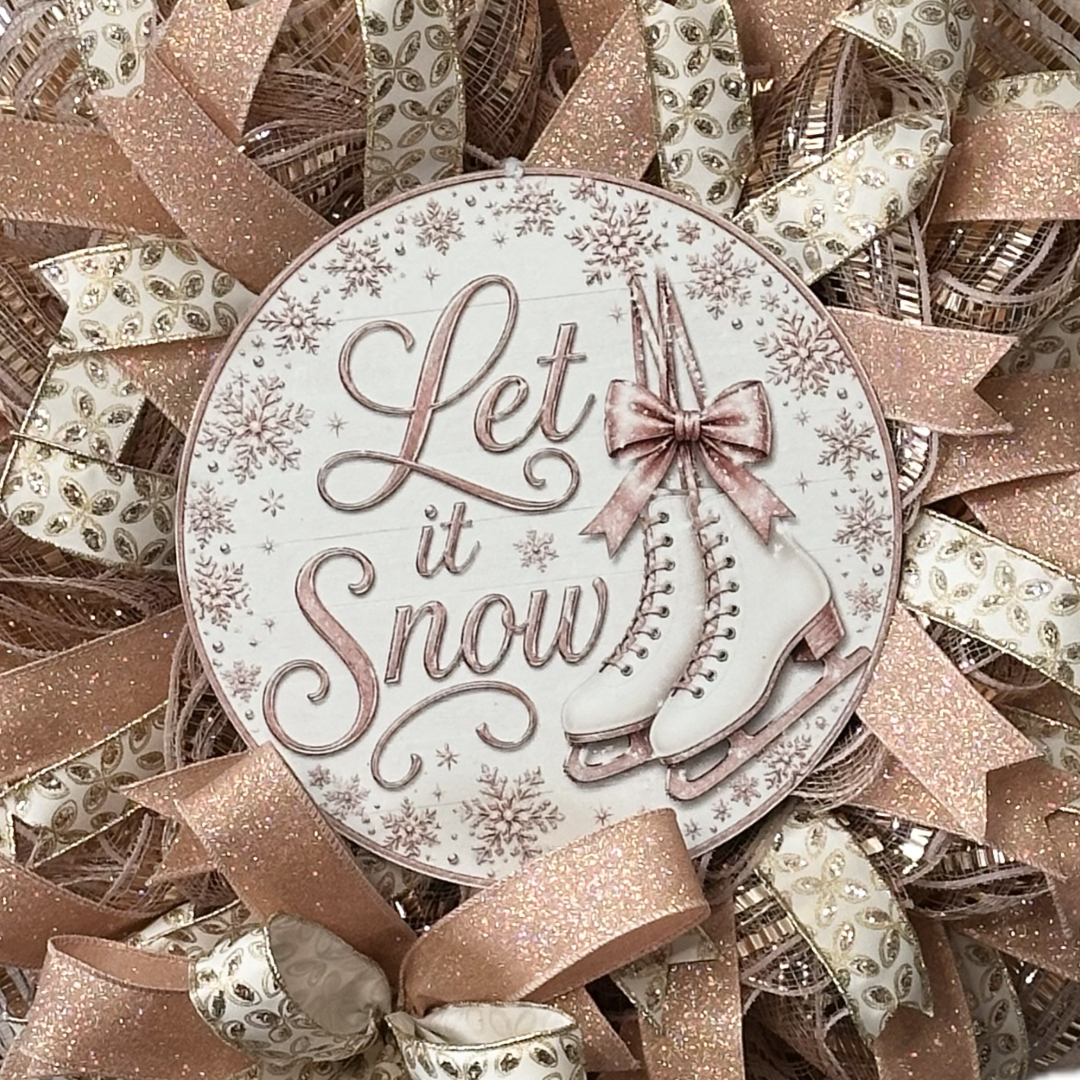 Rose gold deco mesh and ribbon wreath featuring ice skates and "let is snow" by Monkey's Creations. 