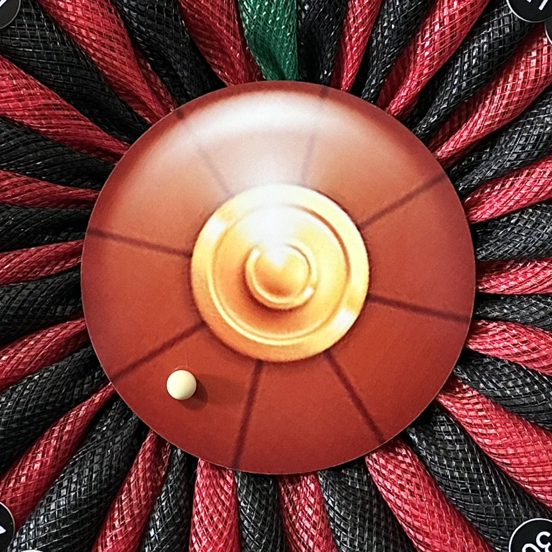 Wreath depicting a roulette wheel with numbers and a ball