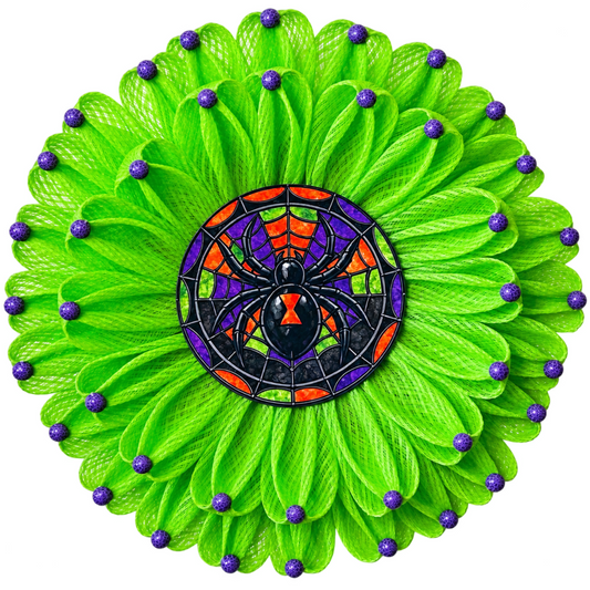 Spooky stained glass spider inspired green deco mesh flower wreath with a purple, orange and green stained glass spider metal wreath center and wood beaded flower accents by Monkey's Creations. 