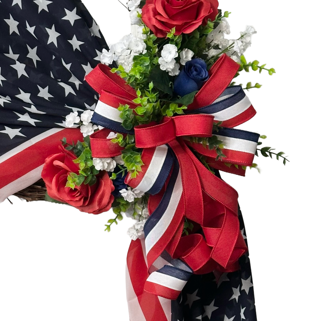 Stars and Stripes draped grapevine with red white and blue flowers and ribbon