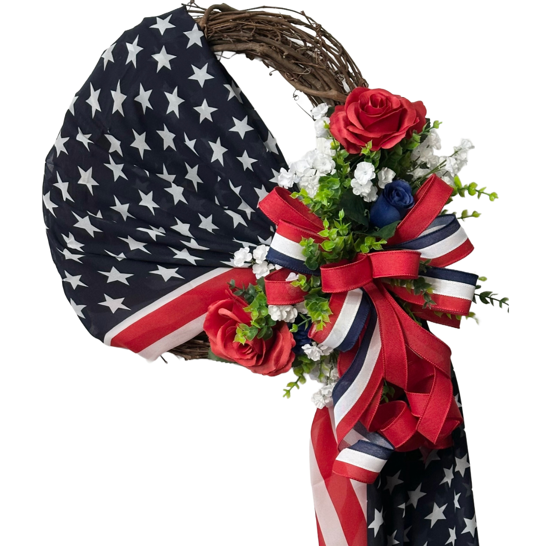 Stars and Stripes draped grapevine with red white and blue flowers and ribbon