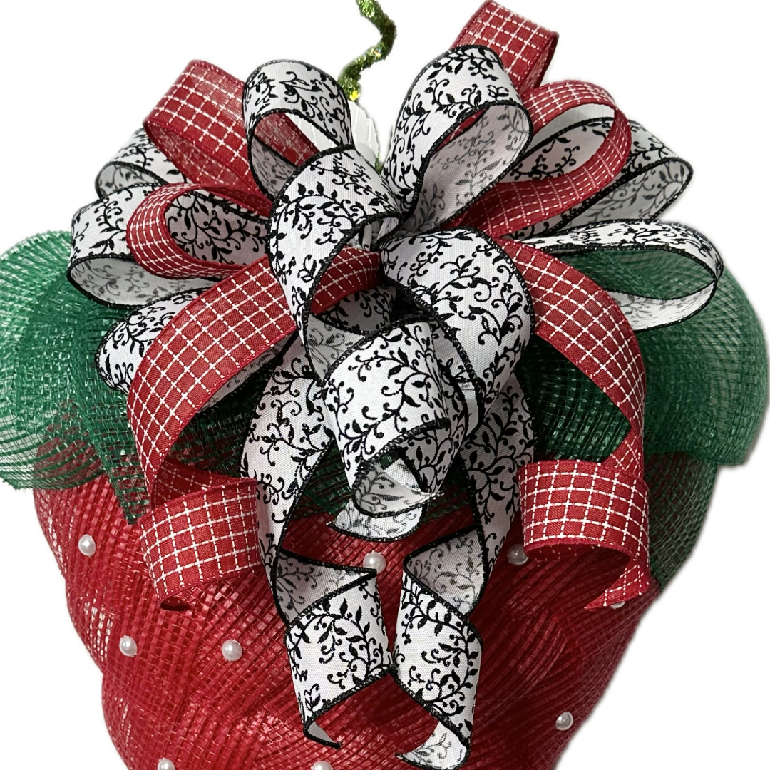 Decorative bow with red, green, and white ribbons 