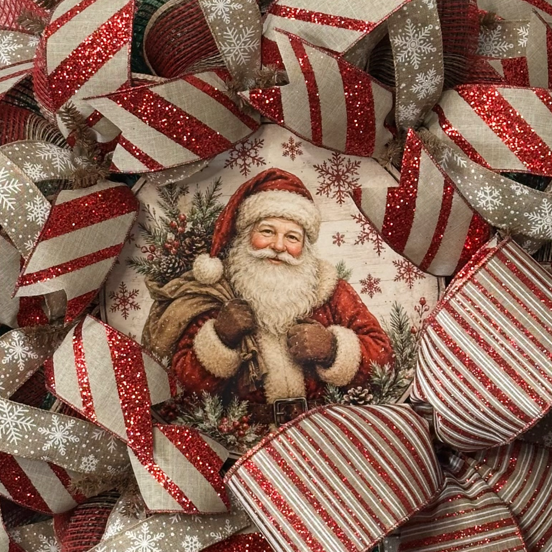 Deco mesh and ribbon wreath with a vintage santa center by Monkey's Creations.