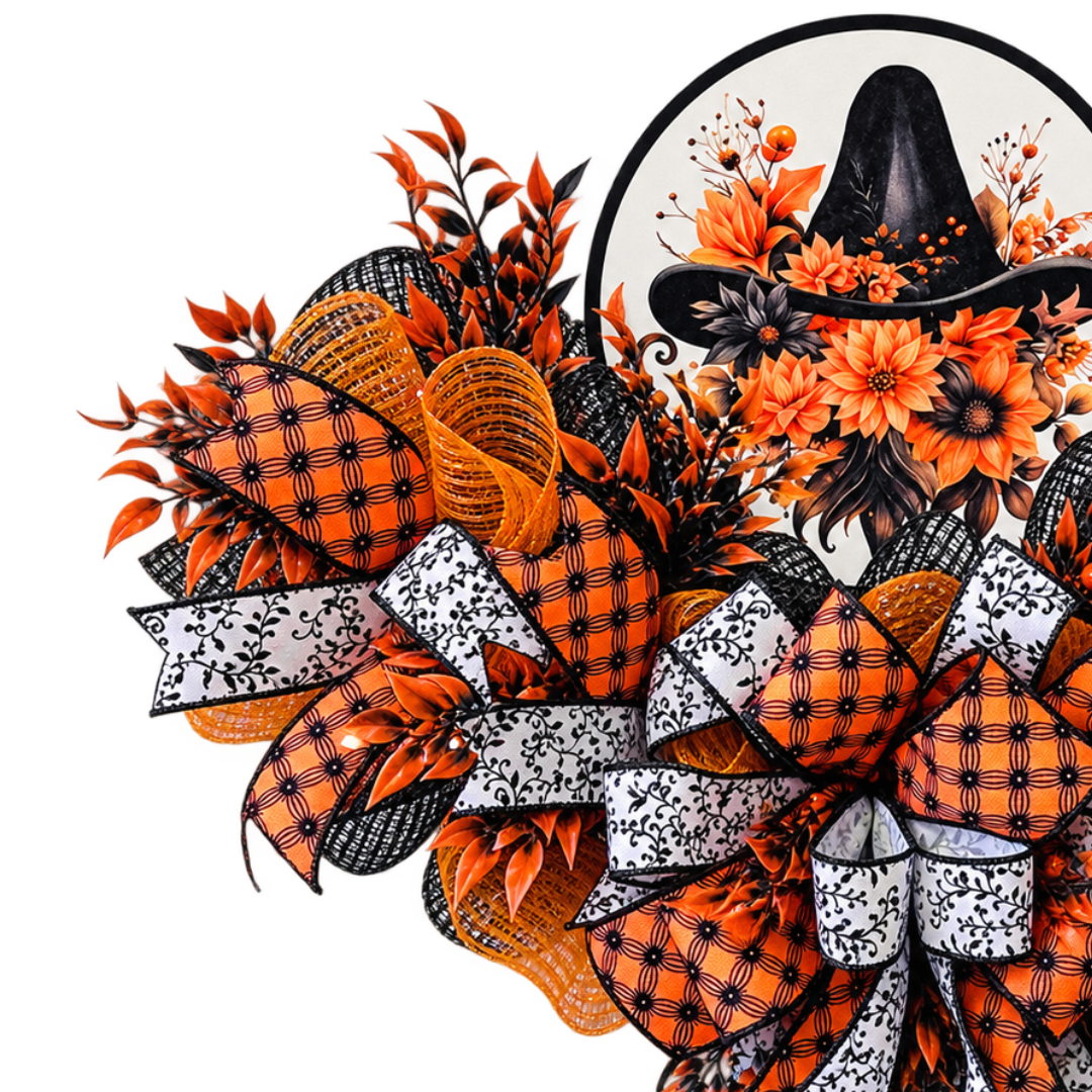 An orange and black Halloween inspired witch hat swag wreath made with deco mesh, ribbon and a round metal wreath sign featuring a witch hat with autumn flowers and foliage by Monkey's Creations.