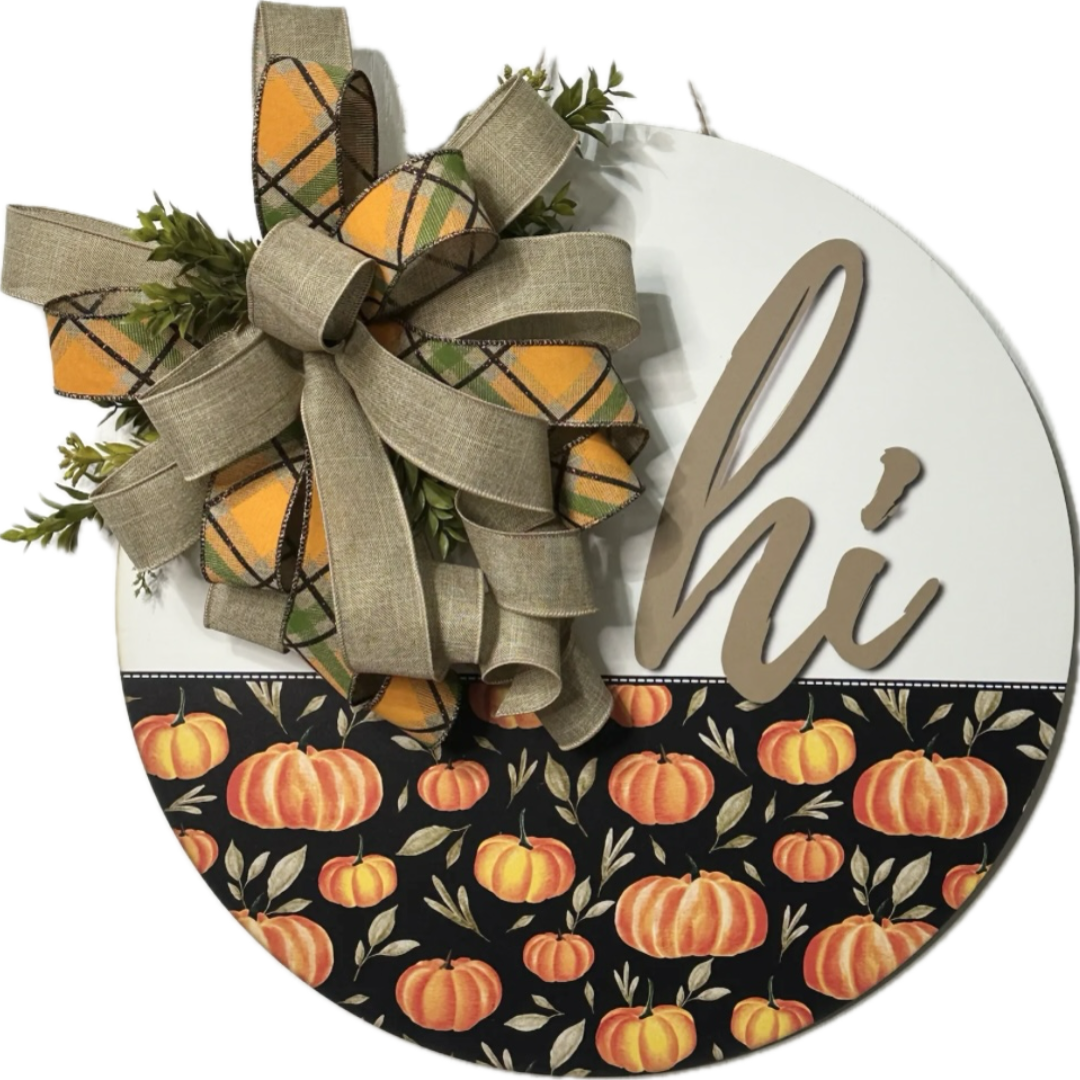 orange, black and beige hi wreath board with pumpkins and a bow with foliage