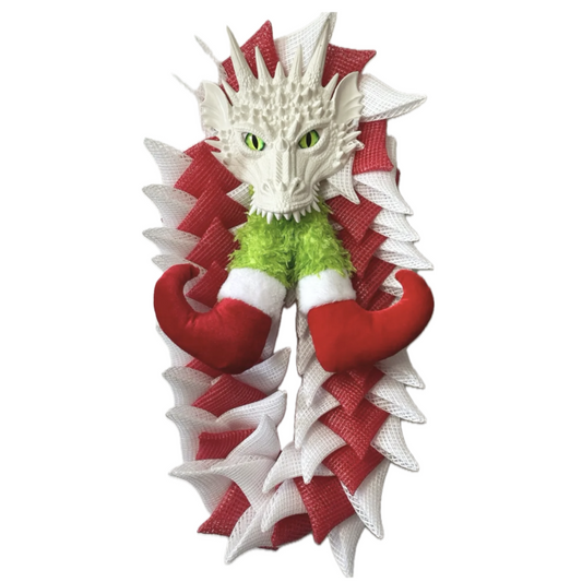 red and white deco mesh christmas dragon with elf legs in its mouth