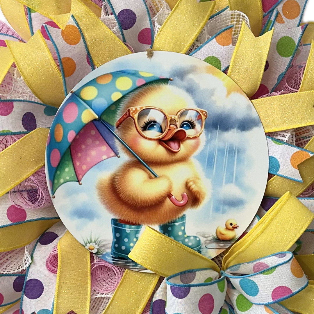 wreath design with a duckling with an umbrella and boots