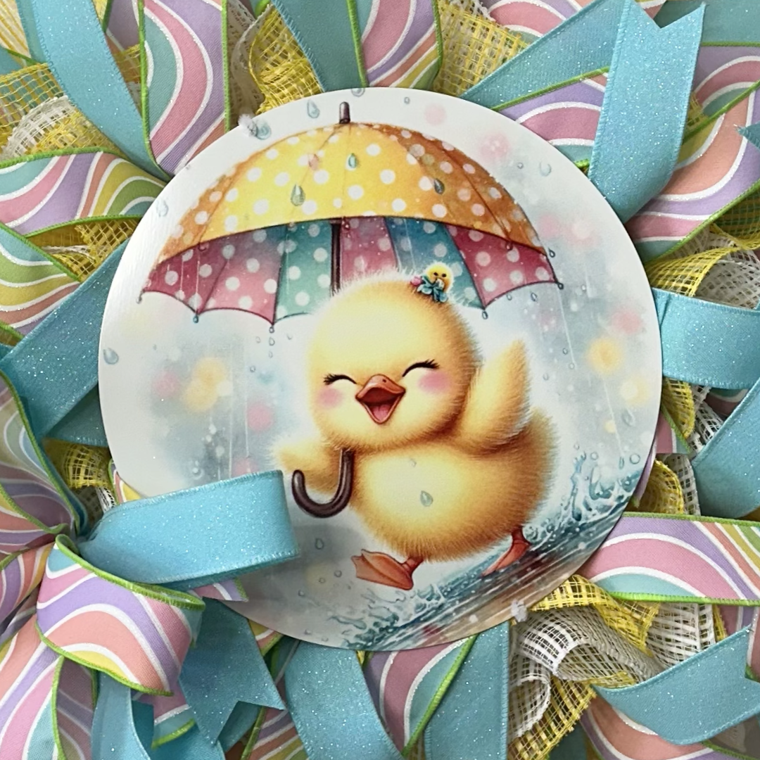 Easter wreath with a duckling holding an umbrella with colorful ribbons and deco mesh 