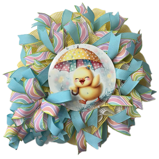 Easter wreath with colorful deco mesh,  ribbons and a duckling holding an umbrella 