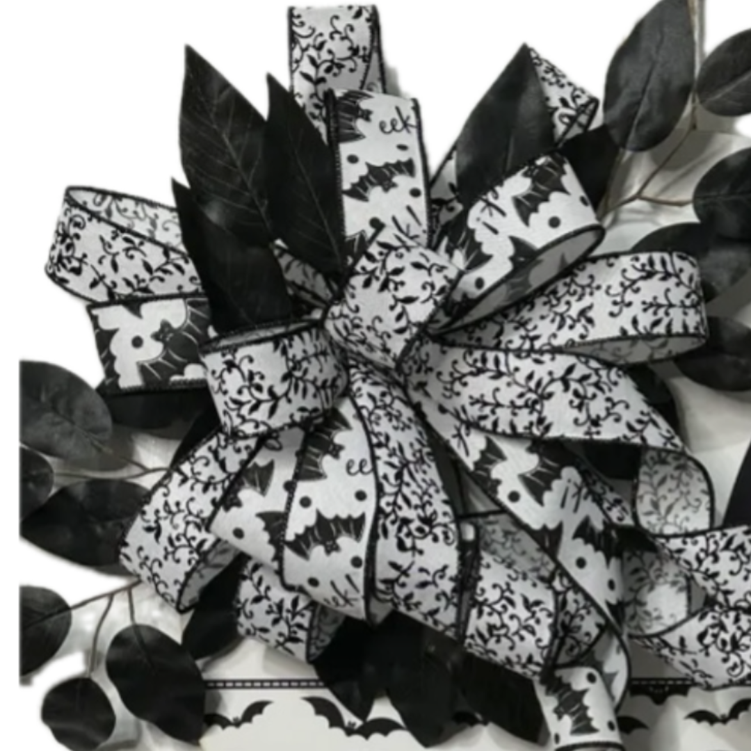 black and white bat themed hi wreath board with black and white bat and foliage ribbon with black picks, focus on the bow