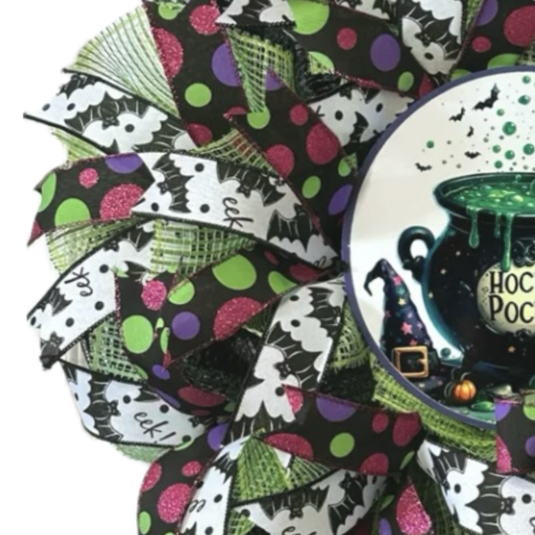 multicolor polka dot and black bat ribbon hocus pocus cauldron halloween wreath, focus on ribbon and deco mesh