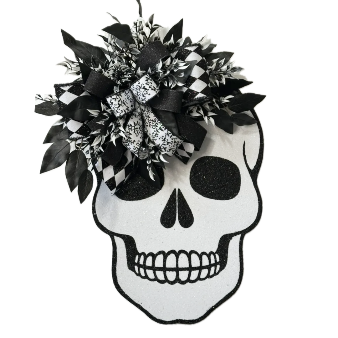 halloween skeleton skull with black and white ribbon and foliage