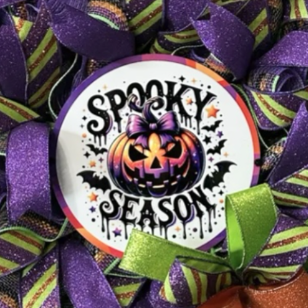 purple , green and orange halloween spooky season pumpkin wreath with ribbon and deco mesh, focus on sign