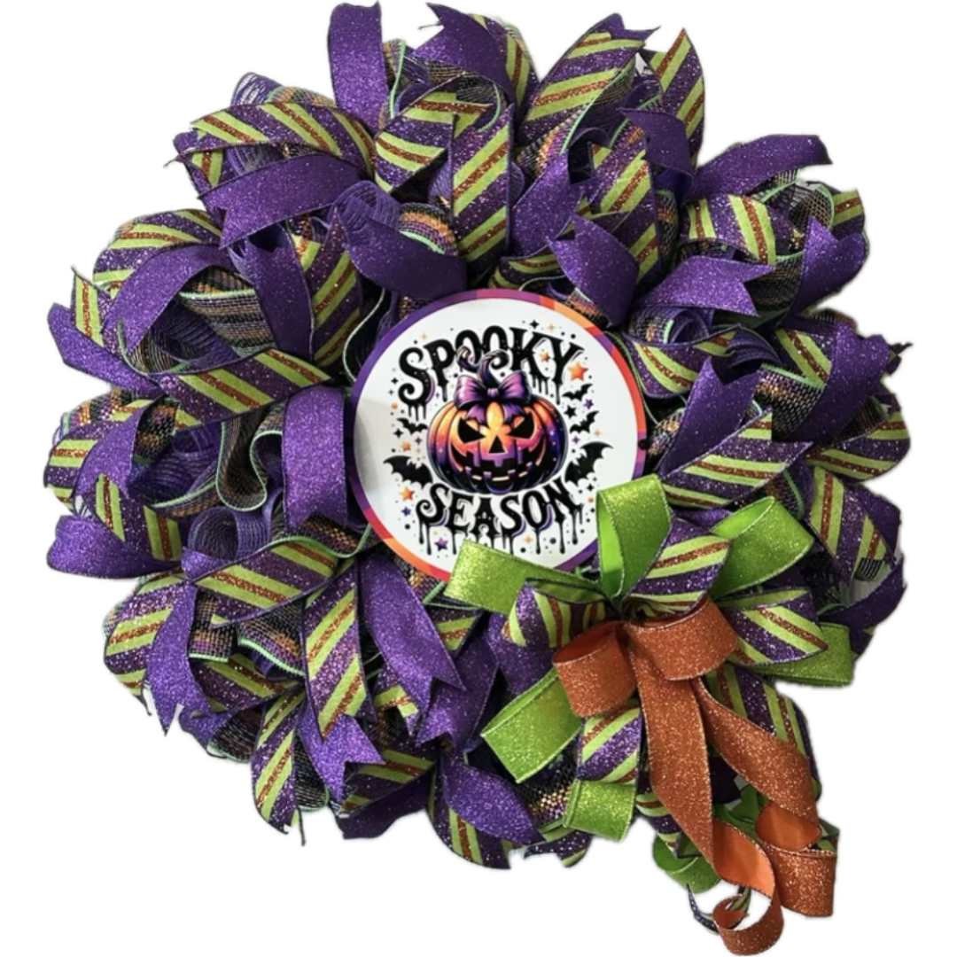 purple , green and orange halloween spooky season pumpkin wreath with ribbon and deco mesh