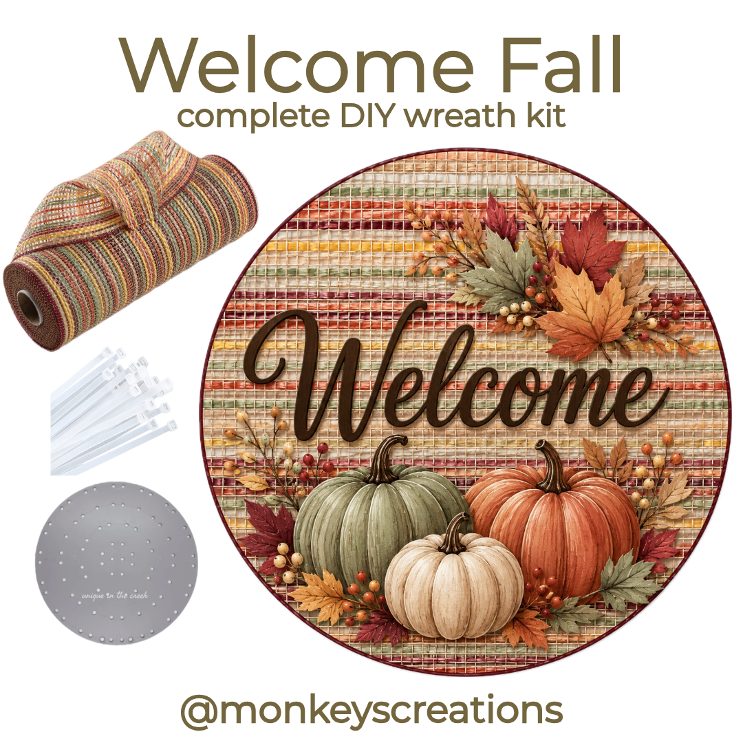 Complete DIY wreath kit featuring a roll of striped autumn colored deco mesh, zip ties, a small board and a round metal welcome Autumn themed wreath sign by Monkey's Creations. 