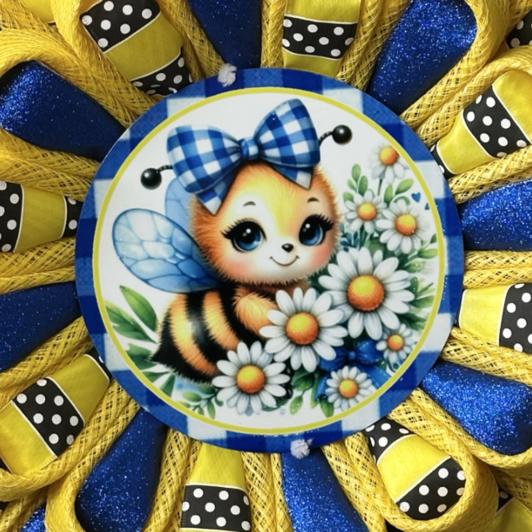 Flower wreath with yellow deco mesh, glitter royal blue ribbon, yellow with black and white polka dot ribbon and a bee with a plaid bow and daisies wreath sign