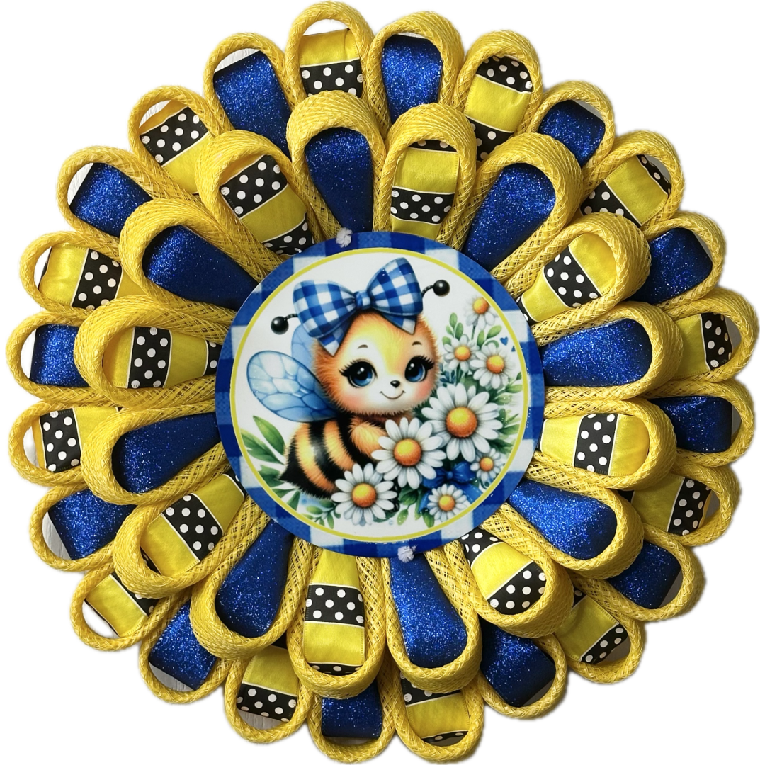 Flower wreath with yellow deco mesh, glitter royal blue ribbon, yellow with black and white polka dot ribbon and a bee with a plaid bow and daisies wreath sign