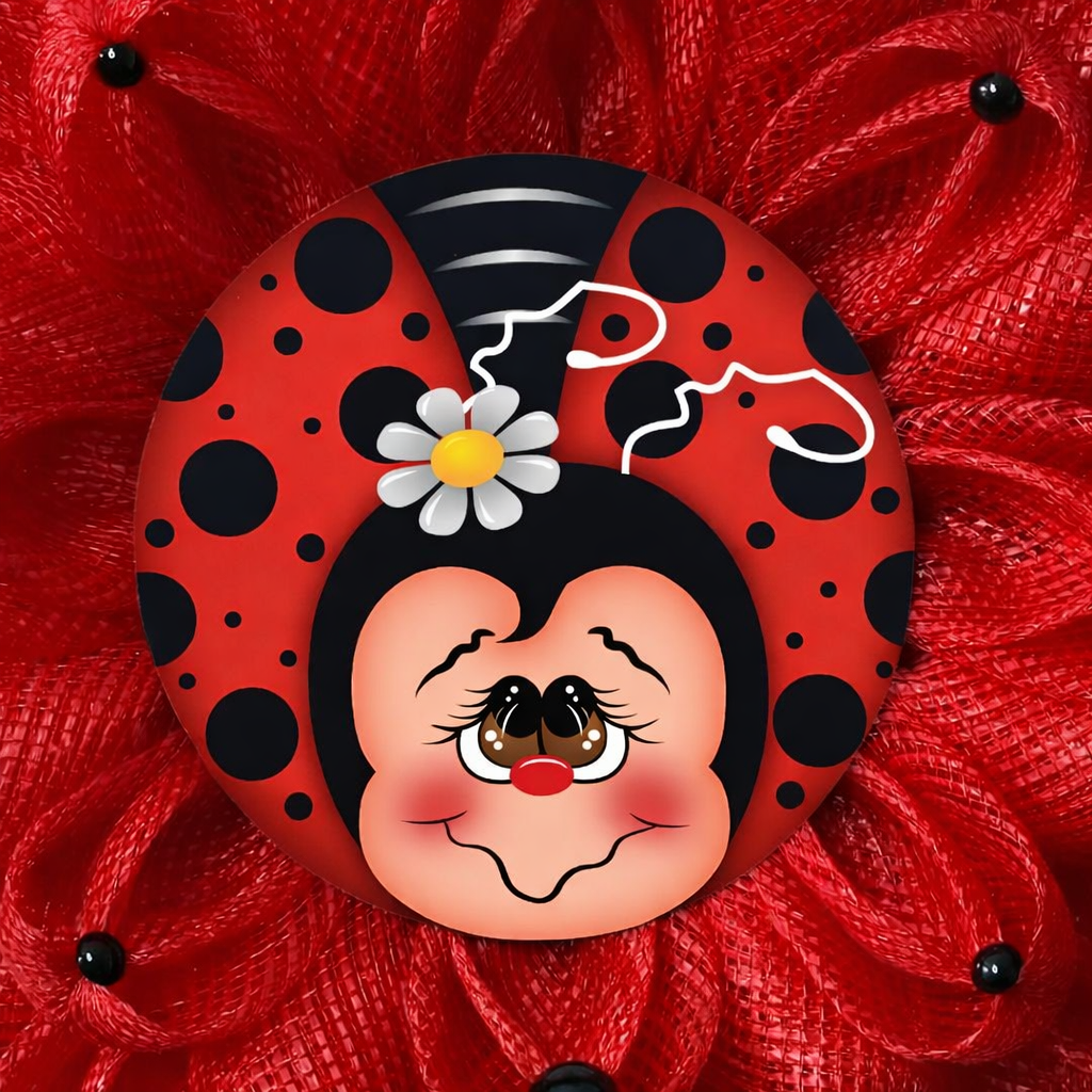 Ladybug inspired wreath with red deco mesh, black dots and a ladybug metal wreath sign in the center 