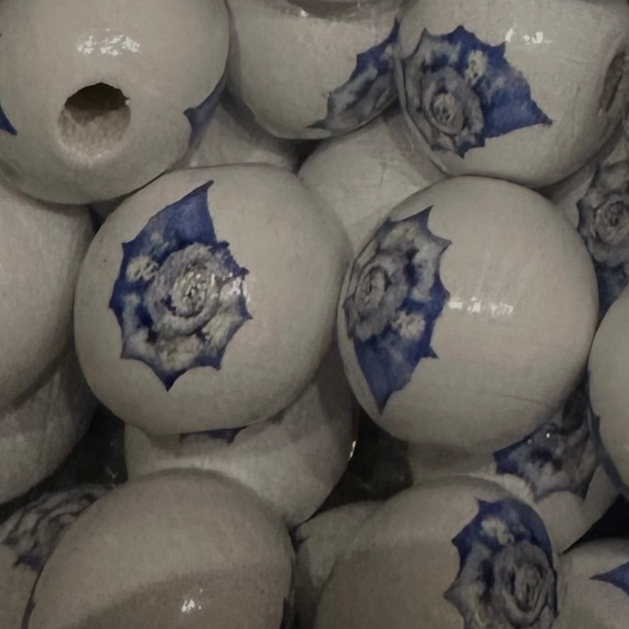 close up of wooden beads with seashell