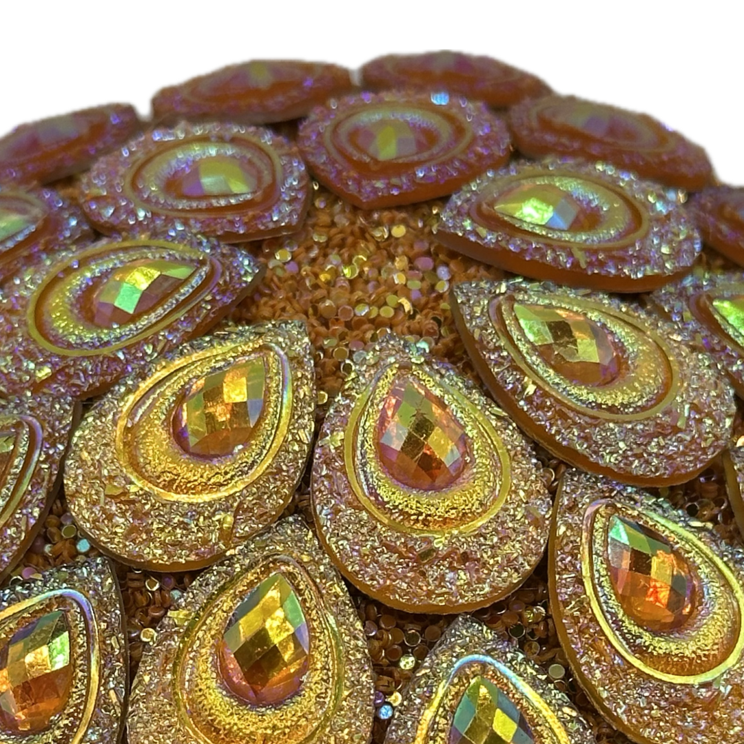 Orange gemstone on round orange glitter Flower center
