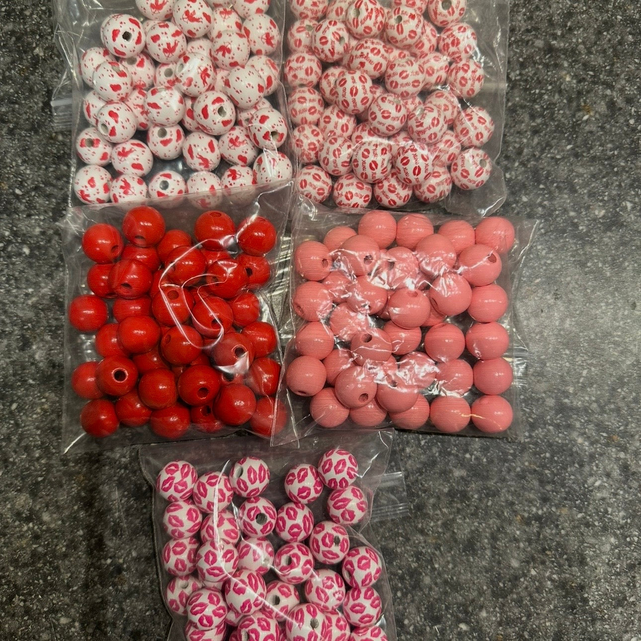 Assorted red and pink wooden valentine beads 